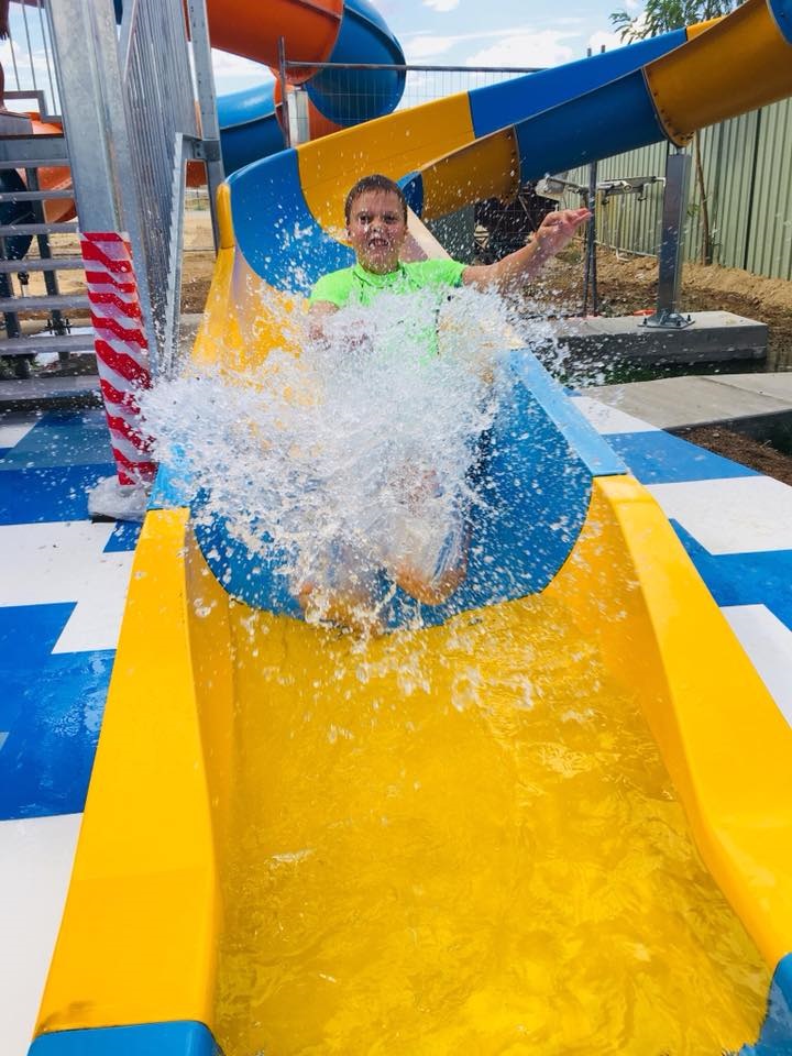 Kid sliding in a waterslide