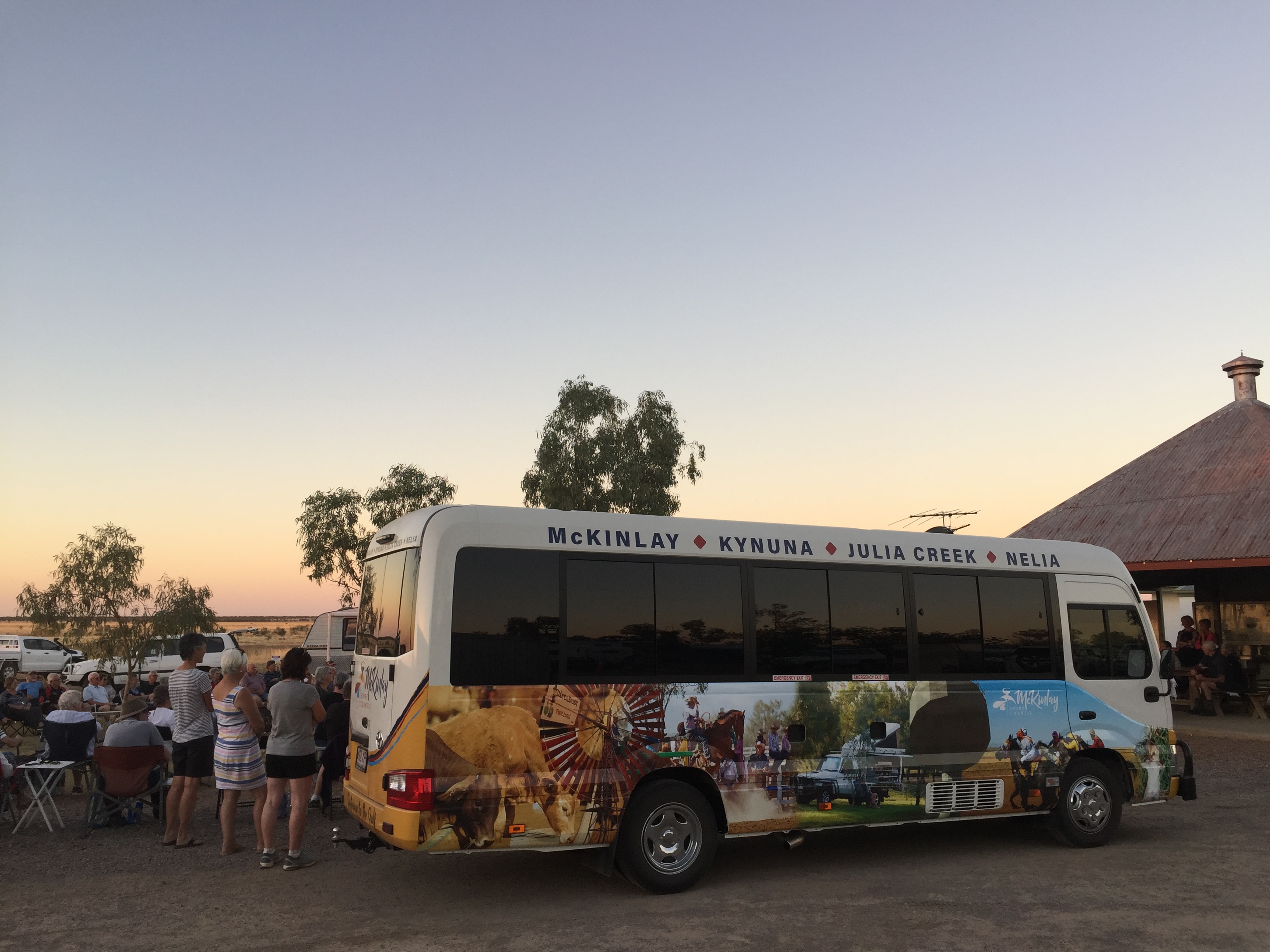 Bus for the McKinlay Council, it features images of McKinlay on the side and the names of its townships at the top: McKinlay, Kynuna, Julia Creek and Nelia